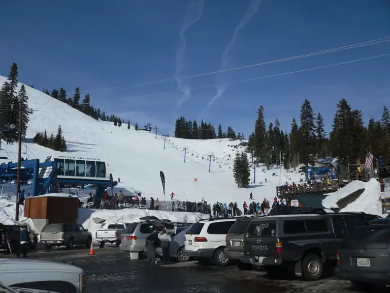 the Donner Ski Ranch base area, ski lift, and snowy slopes